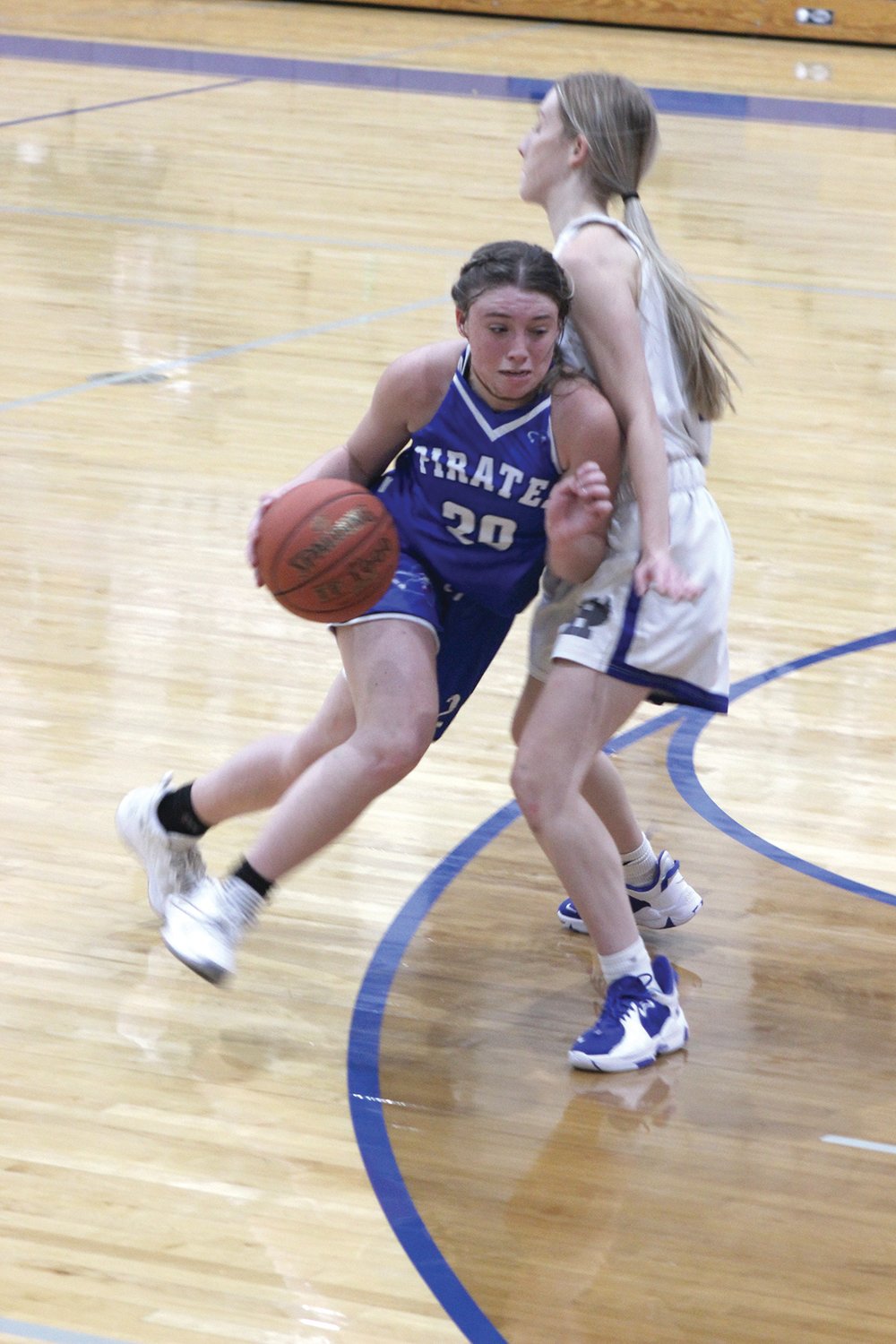 Norwood’s Loran Mooney tries to dribble the ball through a Hartville defender in the Lady Pirate Invitational.